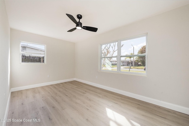 118 1st St, Merritt Island, FL 32953 - unfurnished room featuring light wood-type flooring, baseboards, and a ceiling fan