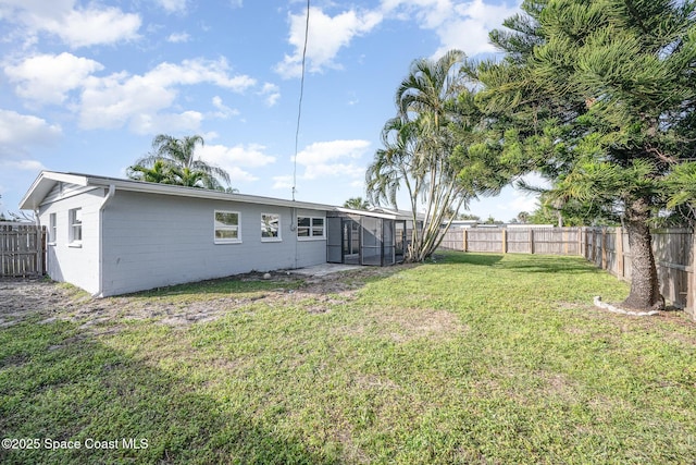 118 1st St, Merritt Island, FL 32953 - view of yard with a sunroom