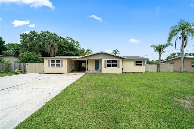 single story home with concrete driveway, an attached carport, and stucco siding