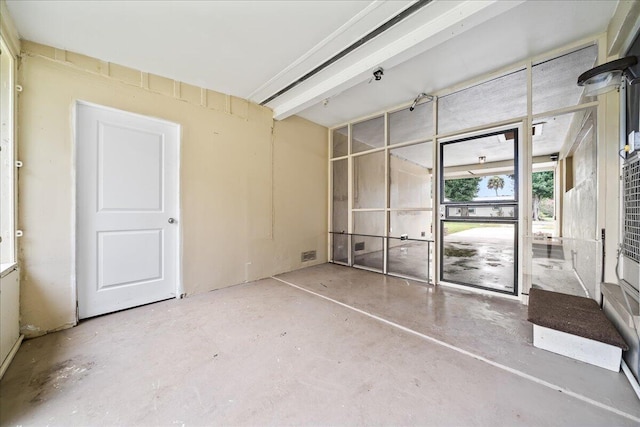 spare room with concrete flooring