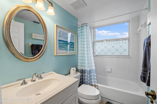 full bath with vanity, toilet, and shower / tub combo with curtain