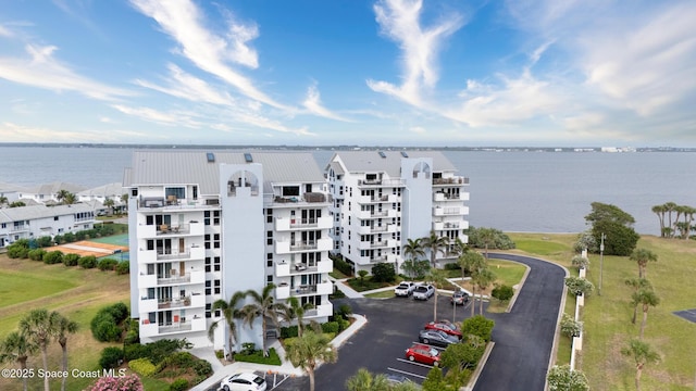 aerial view of apartment complex and a nearby body of water