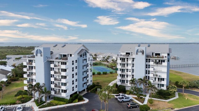 aerial view of a large body of water and apartment complex