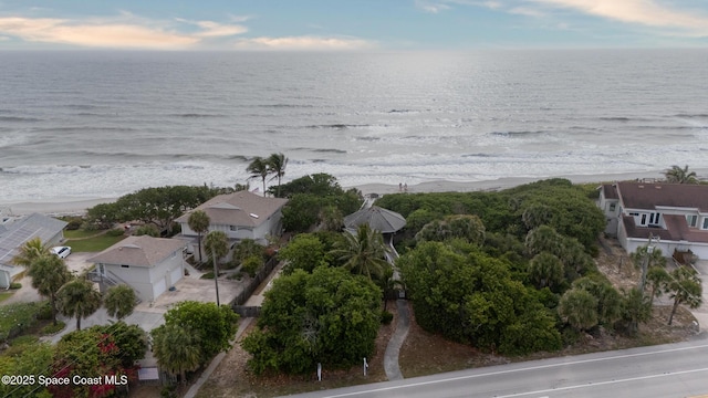 bird's eye view of waterfront with a beach