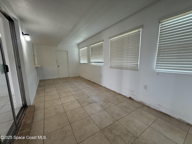 empty room with tile patterned flooring
