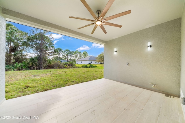 view of patio featuring ceiling fan