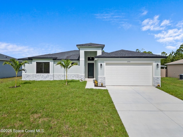 2990 Hackensack Ave SE, Palm Bay, FL 32909 - prairie-style home with stone siding, a garage, stucco siding, and a front yard