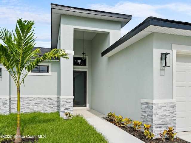 2990 Hackensack Ave SE, Palm Bay, FL 32909 - entrance to property with stone siding, stucco siding, and an attached garage
