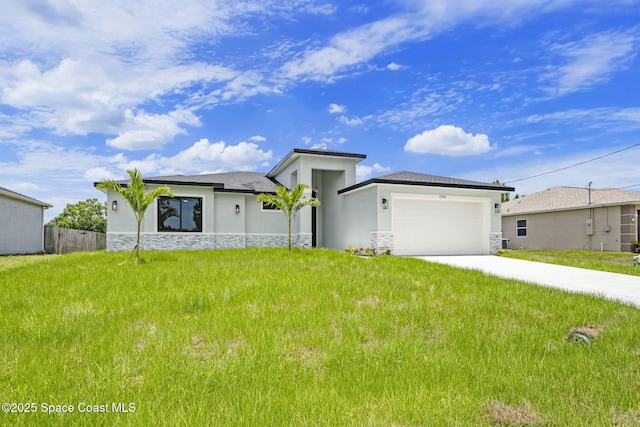 2990 Hackensack Ave SE, Palm Bay, FL 32909 - prairie-style house featuring stucco siding, stone siding, an attached garage, and concrete driveway