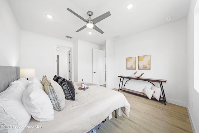 2990 Hackensack Ave SE, Palm Bay, FL 32909 - bedroom featuring recessed lighting, light wood-style flooring, and a ceiling fan