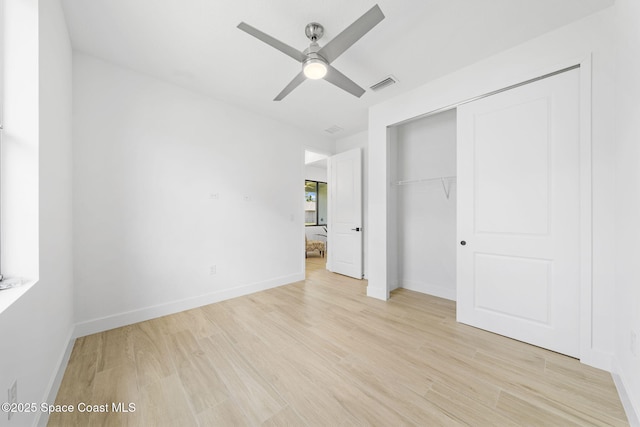 2990 Hackensack Ave SE, Palm Bay, FL 32909 - unfurnished bedroom with light wood-type flooring, a closet, and ceiling fan