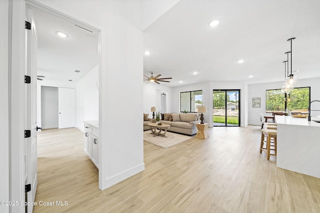 2990 Hackensack Ave SE, Palm Bay, FL 32909 - living area with recessed lighting, light wood finished floors, and a ceiling fan
