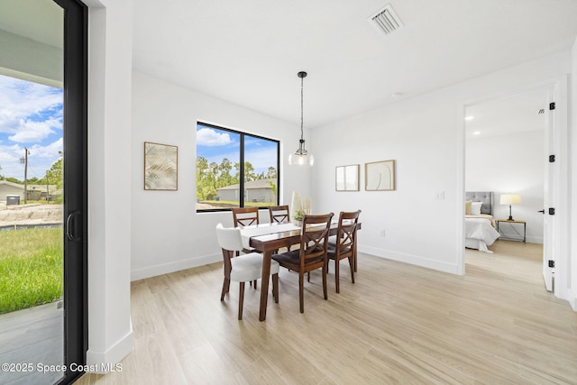 2990 Hackensack Ave SE, Palm Bay, FL 32909 - dining room featuring light wood-style flooring and baseboards