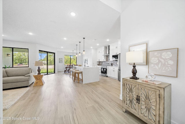 2990 Hackensack Ave SE, Palm Bay, FL 32909 - living room featuring recessed lighting and light wood finished floors