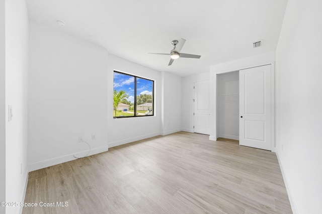 2990 Hackensack Ave SE, Palm Bay, FL 32909 - unfurnished bedroom with light wood-style floors, a closet, and a ceiling fan