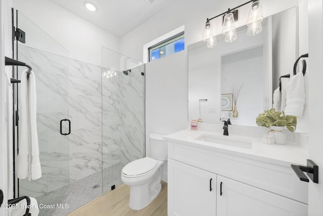 2990 Hackensack Ave SE, Palm Bay, FL 32909 - bathroom with a marble finish shower, vanity, and wood finished floors