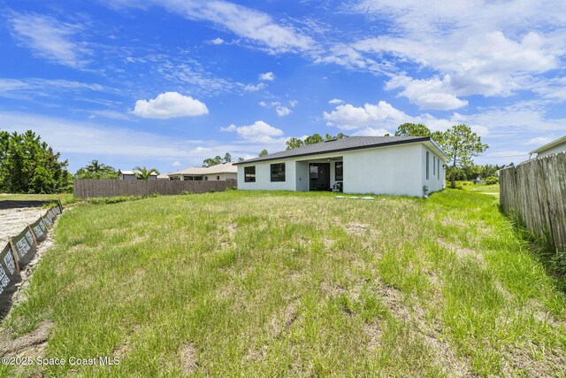 2990 Hackensack Ave SE, Palm Bay, FL 32909 - back of property featuring stucco siding
