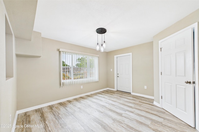 2341 Pawnee Dr, Melbourne, FL 32935 - empty room with light wood-type flooring and baseboards