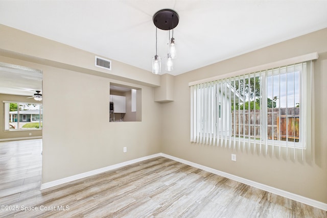 2341 Pawnee Dr, Melbourne, FL 32935 - spare room featuring wood finished floors, baseboards, and ceiling fan