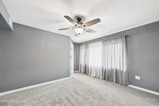 2341 Pawnee Dr, Melbourne, FL 32935 - spare room with ceiling fan, carpet floors, and baseboards