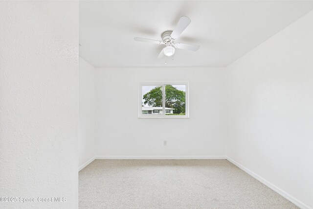 2341 Pawnee Dr, Melbourne, FL 32935 - carpeted empty room featuring ceiling fan and baseboards