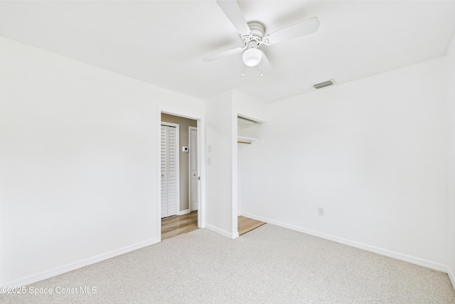 2341 Pawnee Dr, Melbourne, FL 32935 - unfurnished bedroom featuring carpet flooring, baseboards, a ceiling fan, and a closet