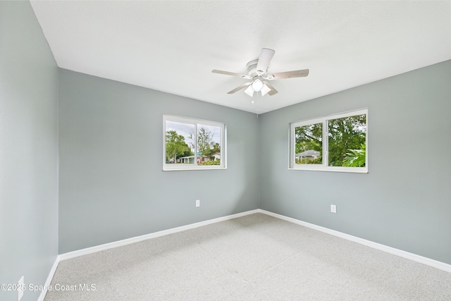 2341 Pawnee Dr, Melbourne, FL 32935 - carpeted empty room with a ceiling fan and baseboards