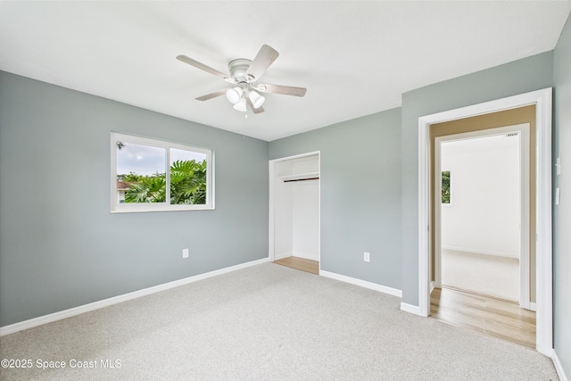 2341 Pawnee Dr, Melbourne, FL 32935 - unfurnished bedroom featuring carpet floors, baseboards, a closet, and a ceiling fan