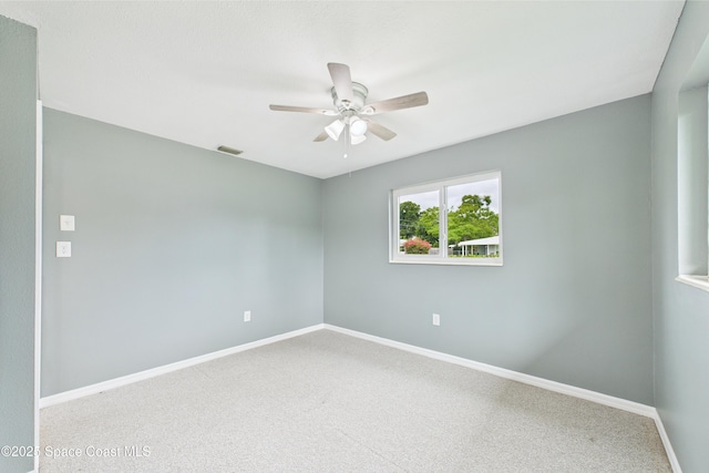 2341 Pawnee Dr, Melbourne, FL 32935 - carpeted empty room with ceiling fan and baseboards