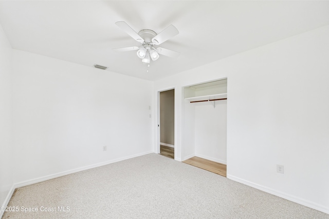2341 Pawnee Dr, Melbourne, FL 32935 - unfurnished bedroom with baseboards, a closet, carpet floors, and a ceiling fan