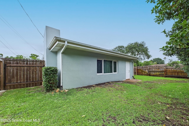 2341 Pawnee Dr, Melbourne, FL 32935 - back of property with stucco siding