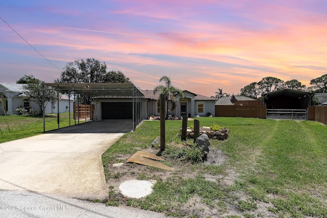 view of front of property featuring concrete driveway and a garage