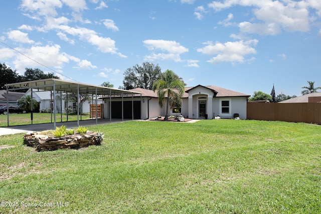 back of house with a carport, driveway, and an attached garage