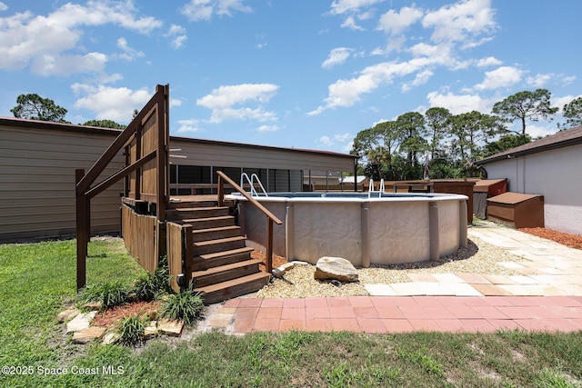 view of patio featuring stairs and an outdoor pool