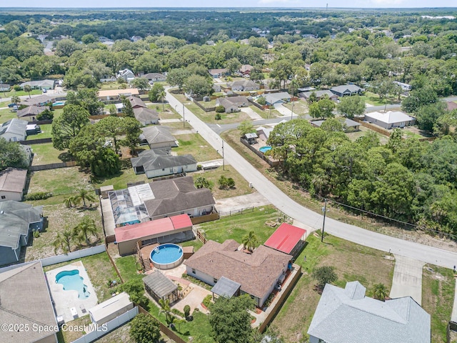 aerial view of residential area with a pool area