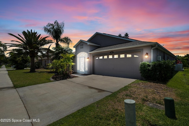 2127 Deercroft Dr, Melbourne, FL 32940 - ranch-style home with a garage, stucco siding, concrete driveway, and a yard