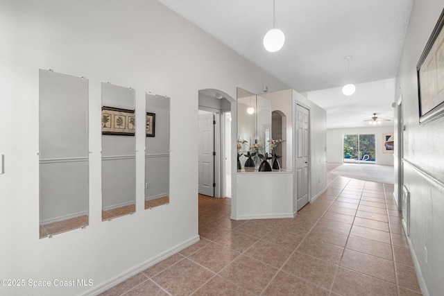 2127 Deercroft Dr, Melbourne, FL 32940 - corridor with arched walkways, tile patterned floors, and baseboards
