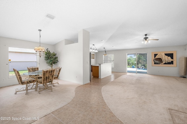 2127 Deercroft Dr, Melbourne, FL 32940 - dining area featuring light tile patterned floors, a chandelier, ceiling fan, and baseboards