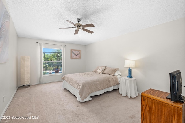2127 Deercroft Dr, Melbourne, FL 32940 - bedroom with light carpet, baseboards, a textured ceiling, and ceiling fan
