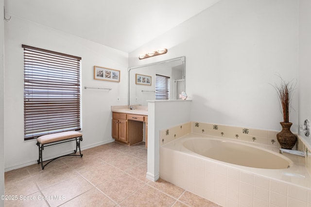 2127 Deercroft Dr, Melbourne, FL 32940 - full bathroom with vanity, a garden tub, tile patterned floors, and vaulted ceiling
