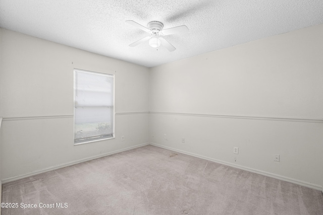 2127 Deercroft Dr, Melbourne, FL 32940 - carpeted empty room with a textured ceiling, a ceiling fan, and baseboards