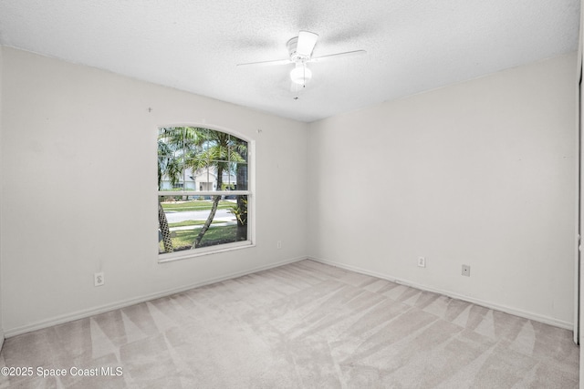 2127 Deercroft Dr, Melbourne, FL 32940 - unfurnished room with light colored carpet, ceiling fan, a textured ceiling, and baseboards