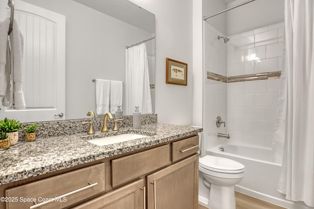 bathroom with toilet, vanity, shower / bath combo, and wood finished floors