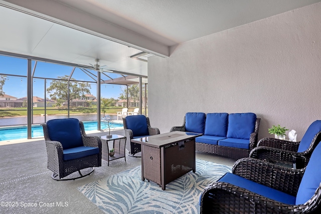 view of patio featuring outdoor lounge area, an outdoor pool, and glass enclosure