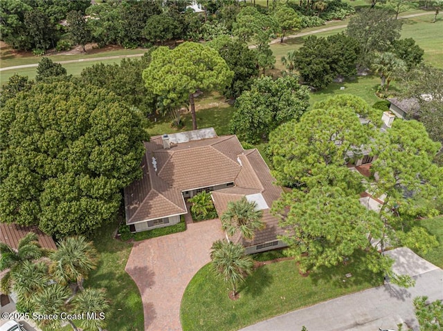 aerial overview of property's location featuring a tree filled landscape