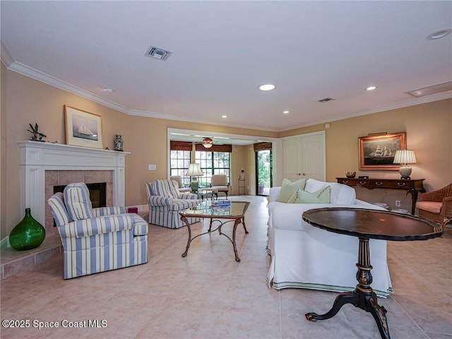 living room featuring crown molding, a fireplace, light tile patterned floors, recessed lighting, and ceiling fan