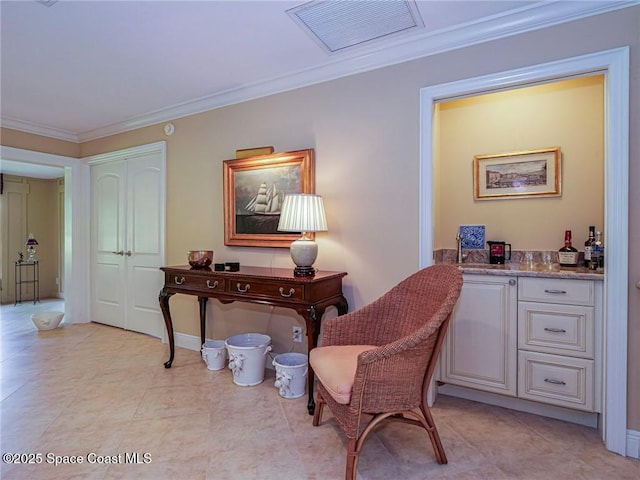 sitting room featuring ornamental molding