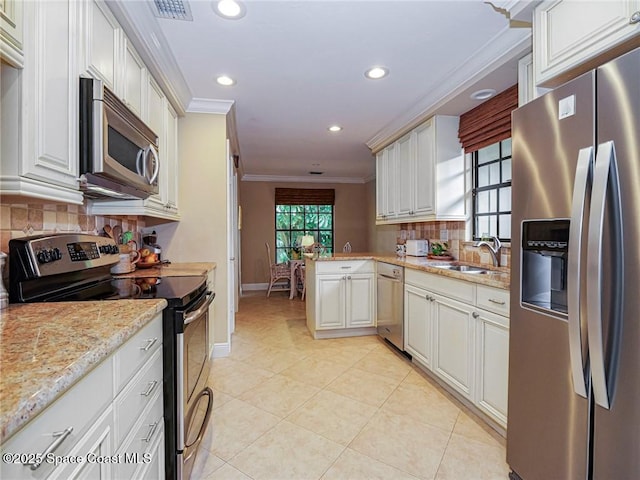 kitchen with stainless steel appliances, ornamental molding, recessed lighting, tasteful backsplash, and baseboards