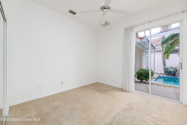 7433 Monterey Ct, Melbourne, FL 32940 - carpeted empty room featuring baseboards and ceiling fan