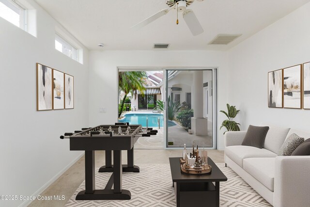 7433 Monterey Ct, Melbourne, FL 32940 - recreation room with ceiling fan, light colored carpet, and baseboards